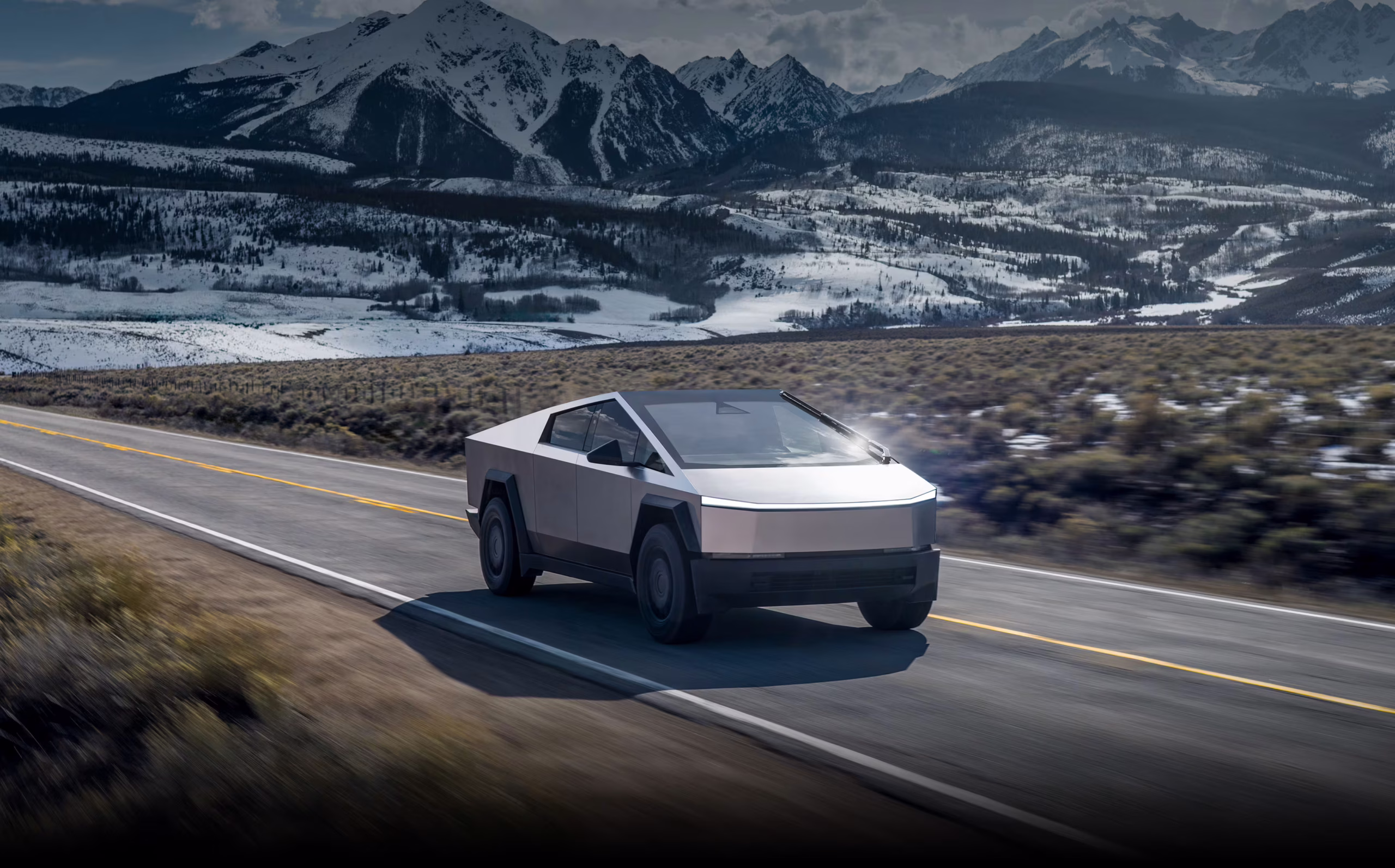 Tesla Cybertruck 2025 parked on rugged terrain showing savings from referral discount