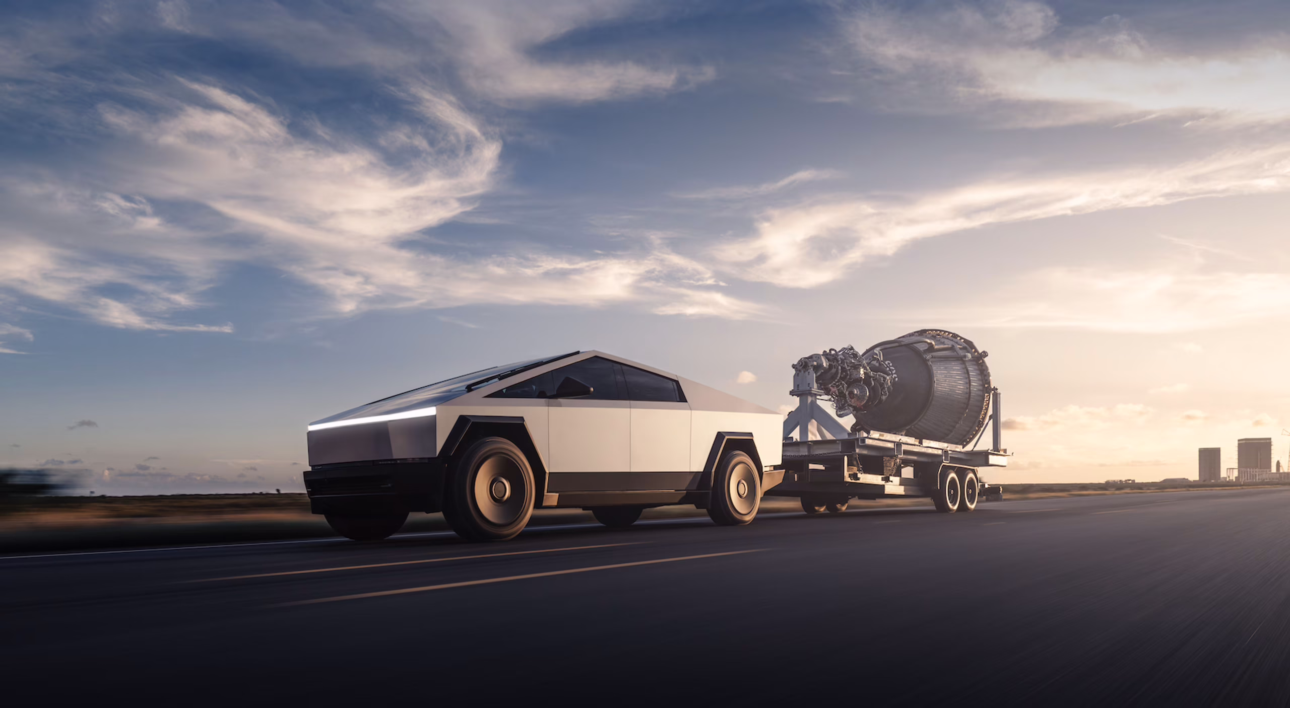 Tesla Cybertruck driving in desert with mountains