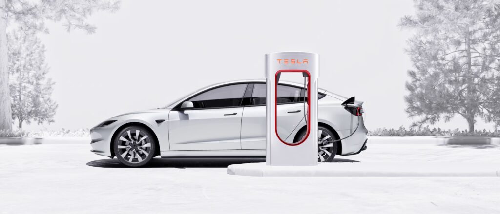 Tesla Model 3 parked at Supercharger displaying referral bonus