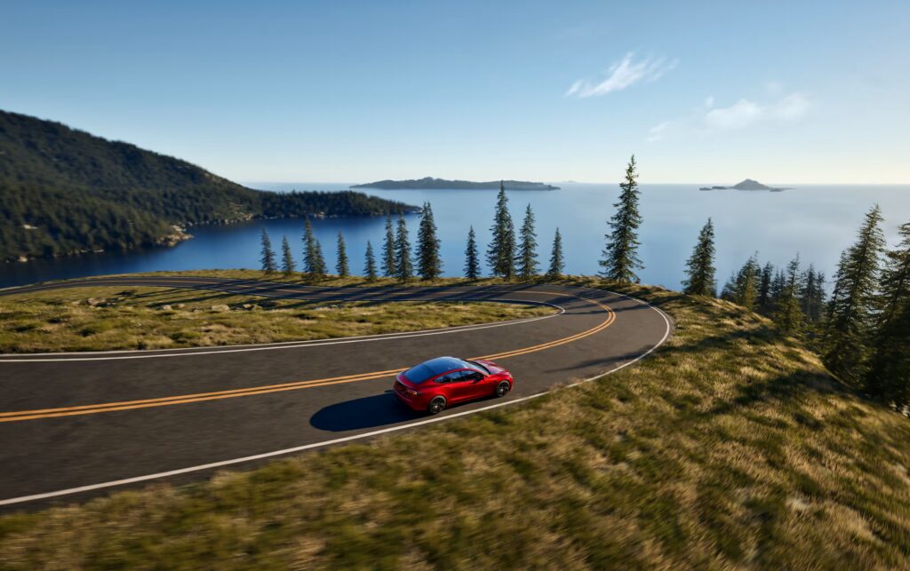 Tesla Model S with scenic mountain background - 2025 referral program