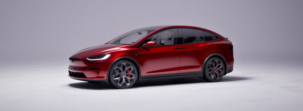 Tesla Model X parked near charging station with referral program activated in 2025