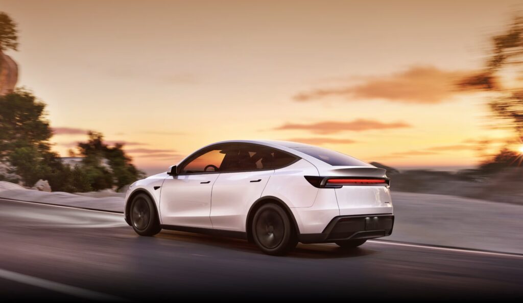 tesla model y parked in front of home – referral bonus offer