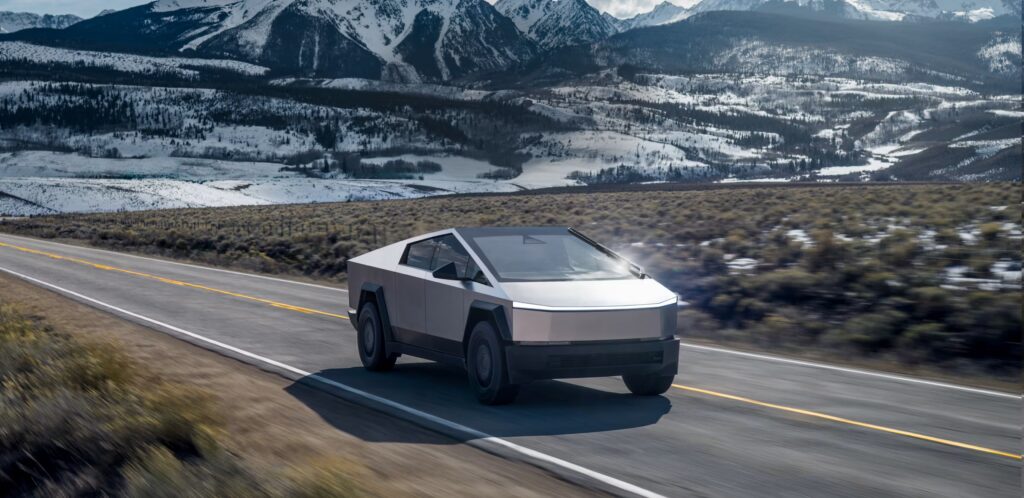 Tesla on road with "Referral Benefits Unlocked" overlay.