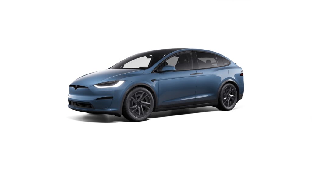 Person reaching for a Tesla referral code for car purchase.