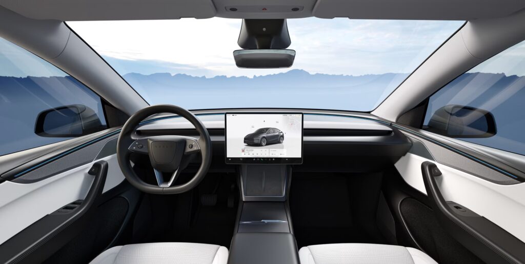 Person adding referral code on Tesla order page before checkout.